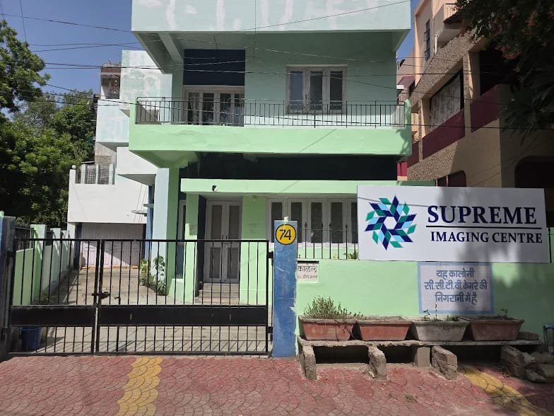 About Us Supreme Imaging Centre building front view in Indore with clinic banner